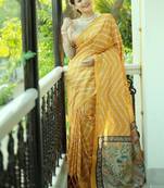 Yellow color tussar silk lehariya printed zari border saree