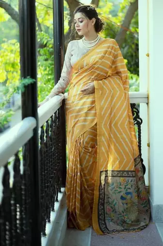Yellow color tussar silk blend lehariya printed zari border saree