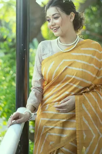 Yellow color tussar silk blend lehariya printed zari border saree