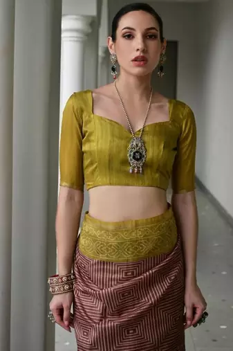 Brown color tussar silk blend ikkat printed saree