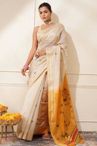 Off-white & yellow color muga cotton resham weaving saree