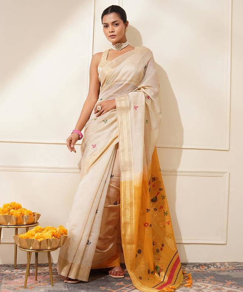 Off-white & yellow color muga cotton resham weaving saree