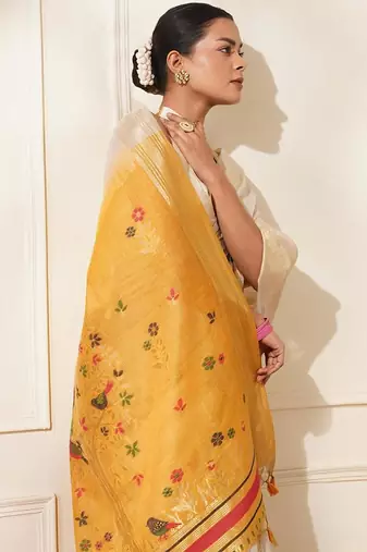 Off-white & yellow color muga cotton resham weaving saree