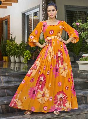 Women mustard all-over floral print georgette fit & flare gown 1