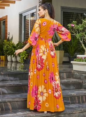 Women mustard all-over floral print georgette fit & flare gown 2