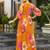 Women mustard all-over floral print georgette fit & flare gown