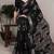 Black rich slub silk printes with zari border saree