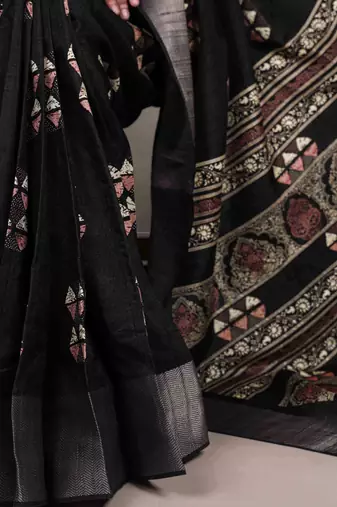 Black rich slub silk printes with zari border saree