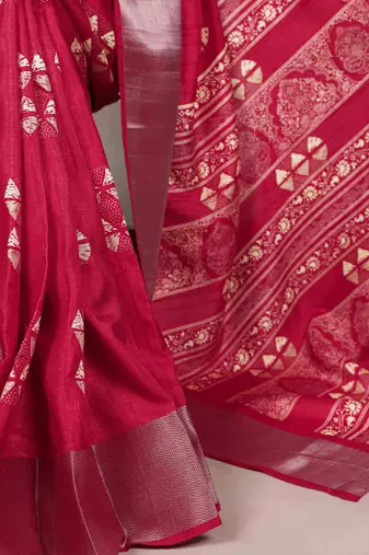 Cherry red rich slub silk printes with zari border saree