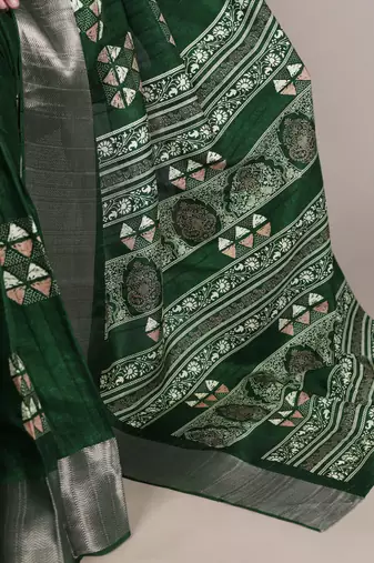 Green rich slub silk printes with zari border saree