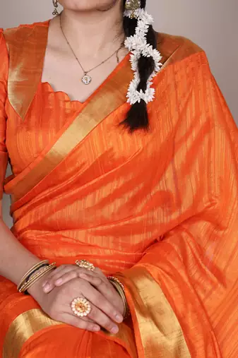 Orange onam special raw silk zari weaving work saree
