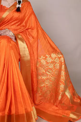 Orange onam special raw silk zari weaving work saree