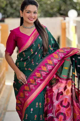 Dark green art silk  woven saree