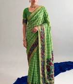 Checkered polyester viscose chanderi saree featuring vibrant printed motifs & traditional zari border