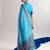 Checkered polyester viscose chanderi saree featuring vibrant printed motifs & traditional zari border