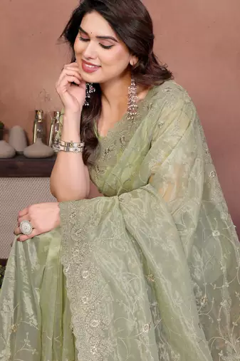 Green twill net embroidery work saree with matching blouse piece