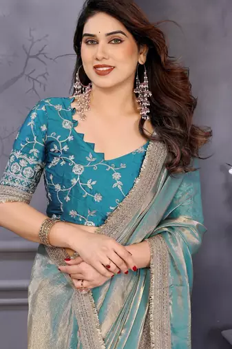 Sky blue fandy satin saree with embroidered lace border and matching blouse piece