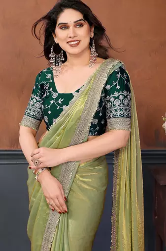 Light green fandy satin saree with embroidered lace border and matching blouse piece
