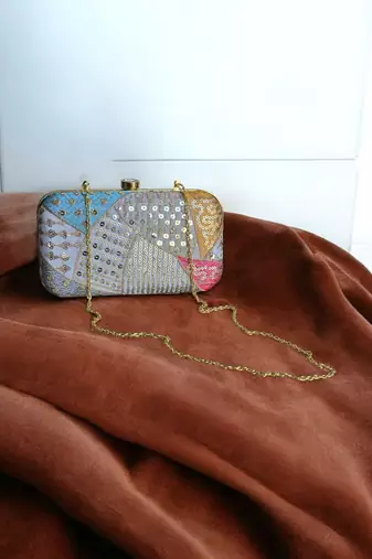 Multicolour sequinned party clutch