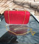 Red sequinned party clutch