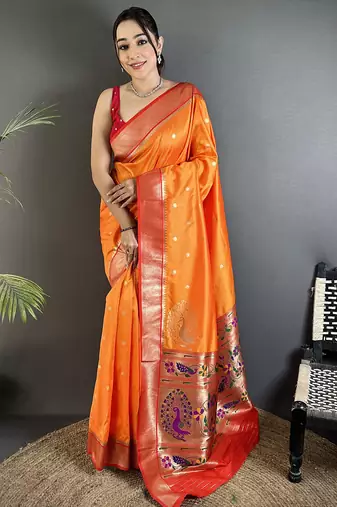 Women orange peacock motifs lichi silk saree