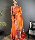 Women orange peacock motifs lichi silk blend saree