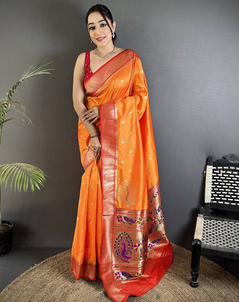 Women orange peacock motifs lichi silk saree