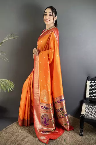 Women orange peacock motifs lichi silk saree