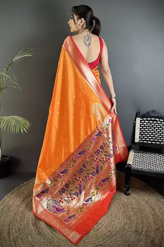 Women orange peacock motifs lichi silk saree