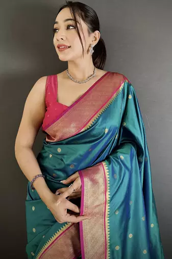 Women teal peacock motifs lichi silk saree