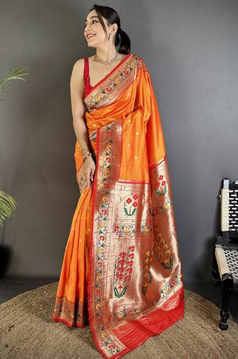 Women orange ikkat floral motifs lichi silk saree