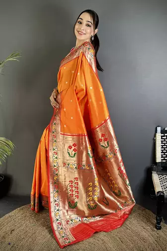 Women orange ikkat floral motifs lichi silk saree