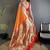Women orange ikkat floral motifs lichi silk saree