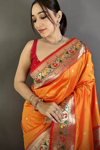 Women orange ikkat floral motifs lichi silk saree