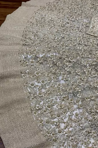 Soft Premium Net Wedding Lehenga In Off White Color With Embroidery & Pearl Work