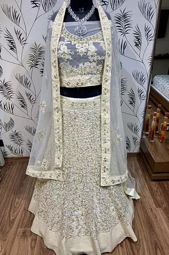 Soft Premium Net Wedding Lehenga In Off White Color With Embroidery & Pearl Work