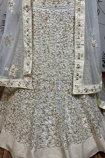 Soft Premium Net Wedding Lehenga In Off White Color With Embroidery & Pearl Work