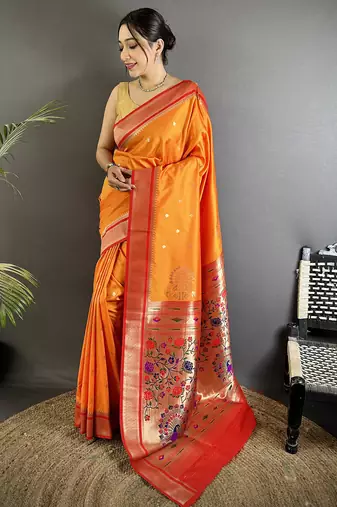 Women orange peacock&floral motifs lichi silk saree