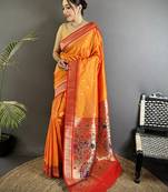 Women orange peacock&floral motifs lichi silk saree
