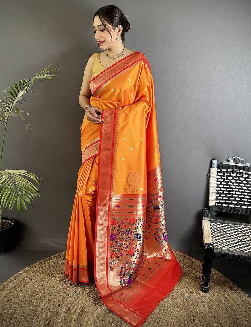 Women orange peacock&floral motifs lichi silk saree