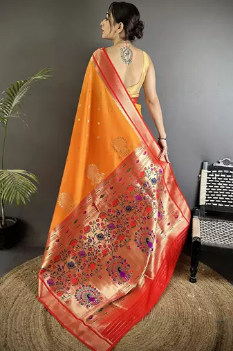 Women orange peacock&floral motifs lichi silk saree