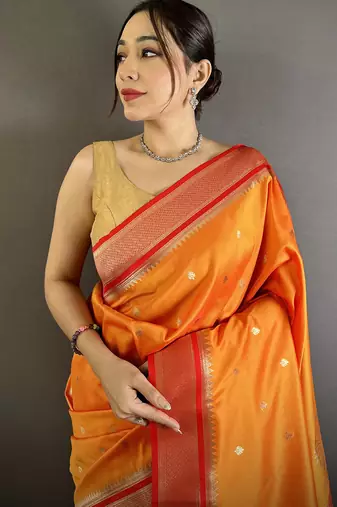Women orange peacock&floral motifs lichi silk saree