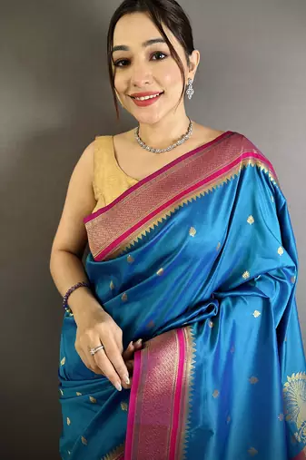 Women teal blue peacock&floral motifs lichi silk saree