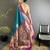 Women teal peacock&floral motifs lichi silk saree