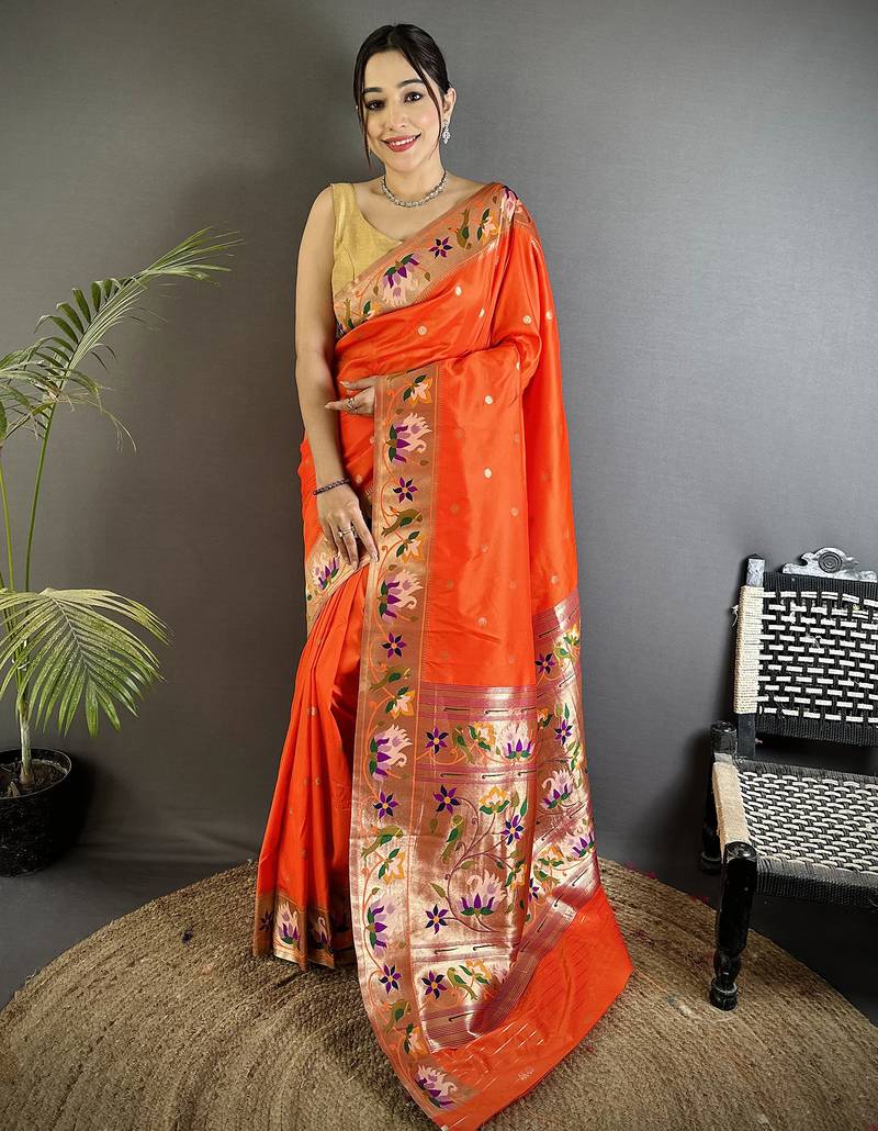 Women orange floral & meena weaving lichi silk saree