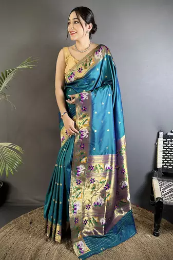 Women teal floral & meena weaving lichi silk saree
