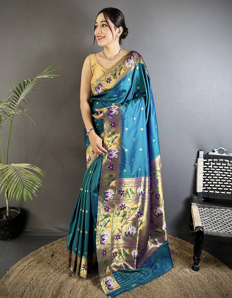 Women teal floral & meena weaving lichi silk saree