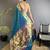 Women teal floral & meena weaving lichi silk saree