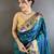 Women teal floral & meena weaving lichi silk saree