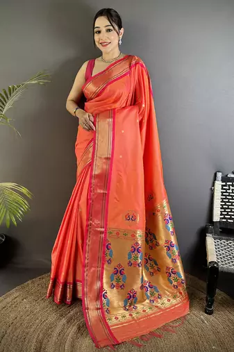 Women orange peacock ethnic motifs lichi silk saree